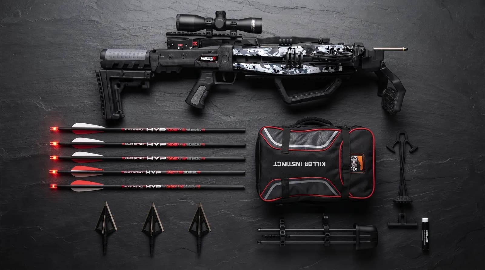 Killer Instinct NEO-X Amazon bundle laid out with crossbow, bolts, broadheads, backpack case, quiver, rope cocker and rail lube