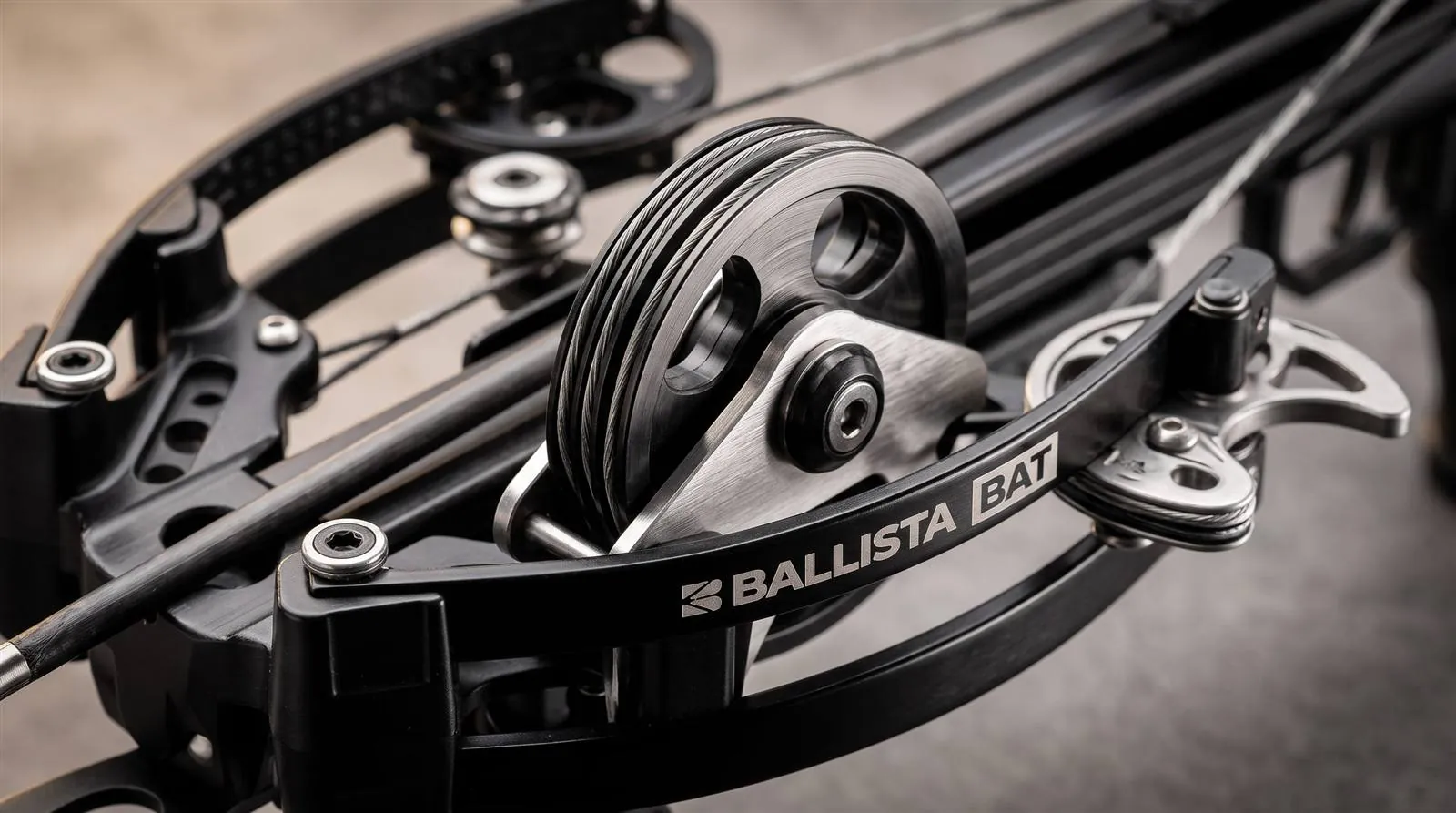 Close-up of the sliderless cable and cam system on a compact compound pistol crossbow