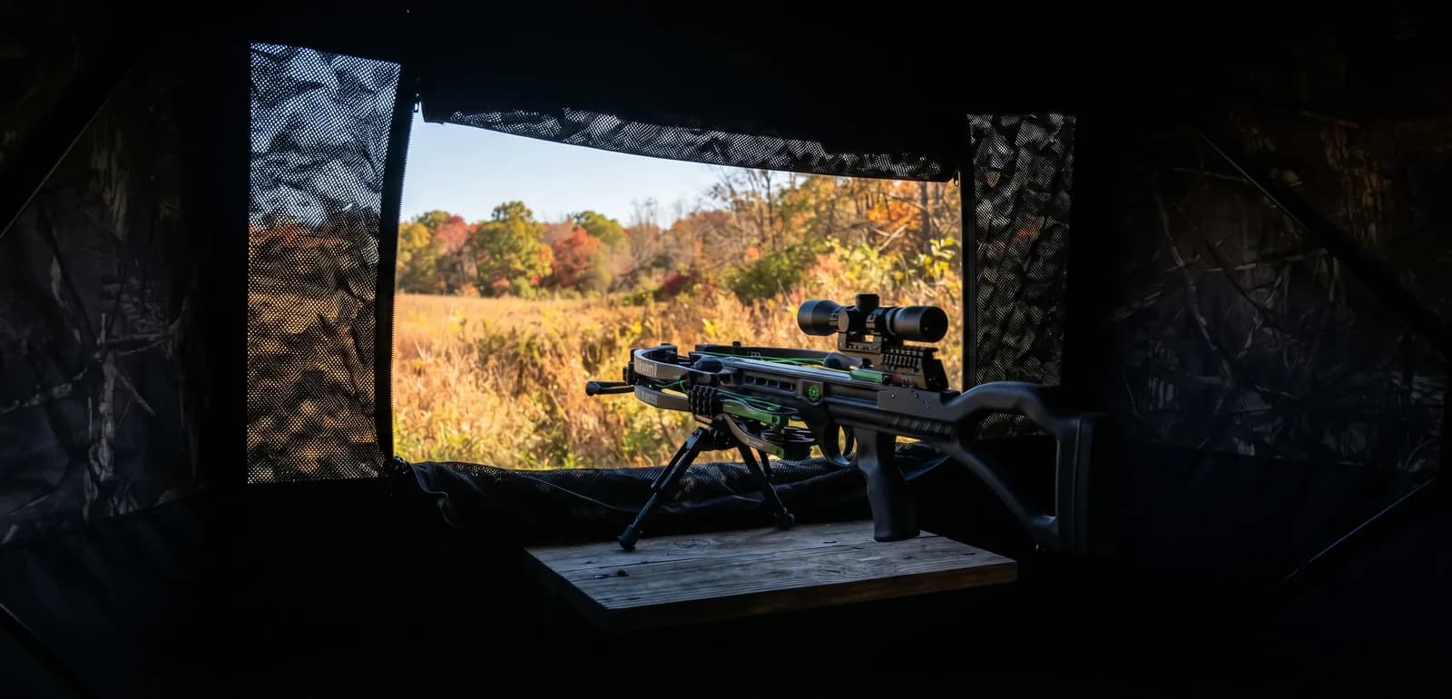 CenterPoint Wrath 430 crossbow on its bipod stirrup inside a ground blind