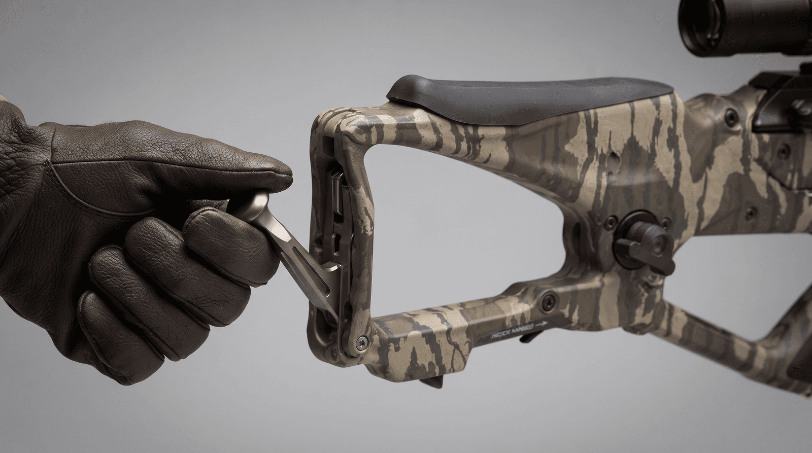 Close view of the ChargerX folding crank handle deployed at the rear of the Excalibur REV X stock