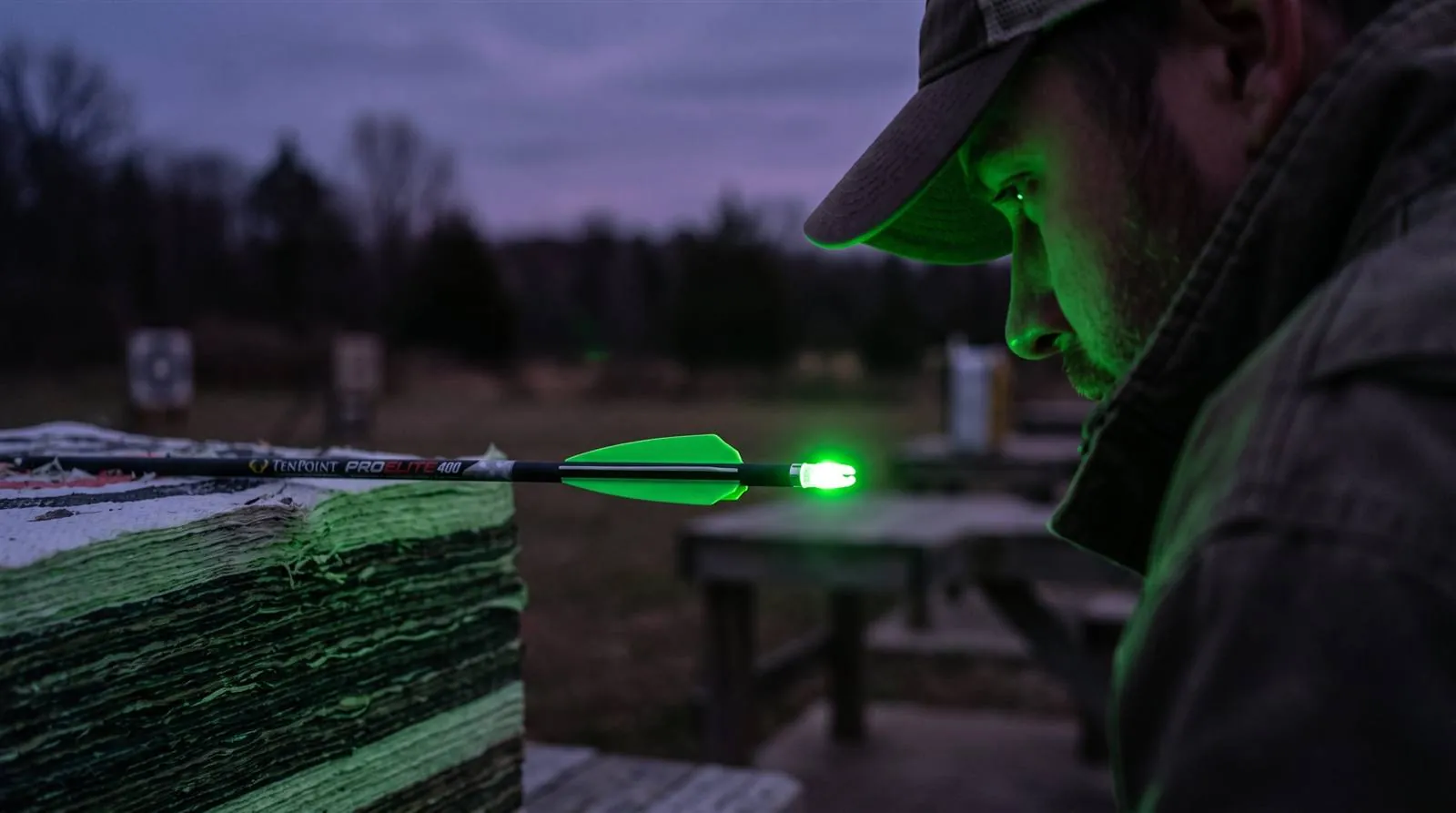 Lighted nock glowing on a bolt in dim light during the illumination test