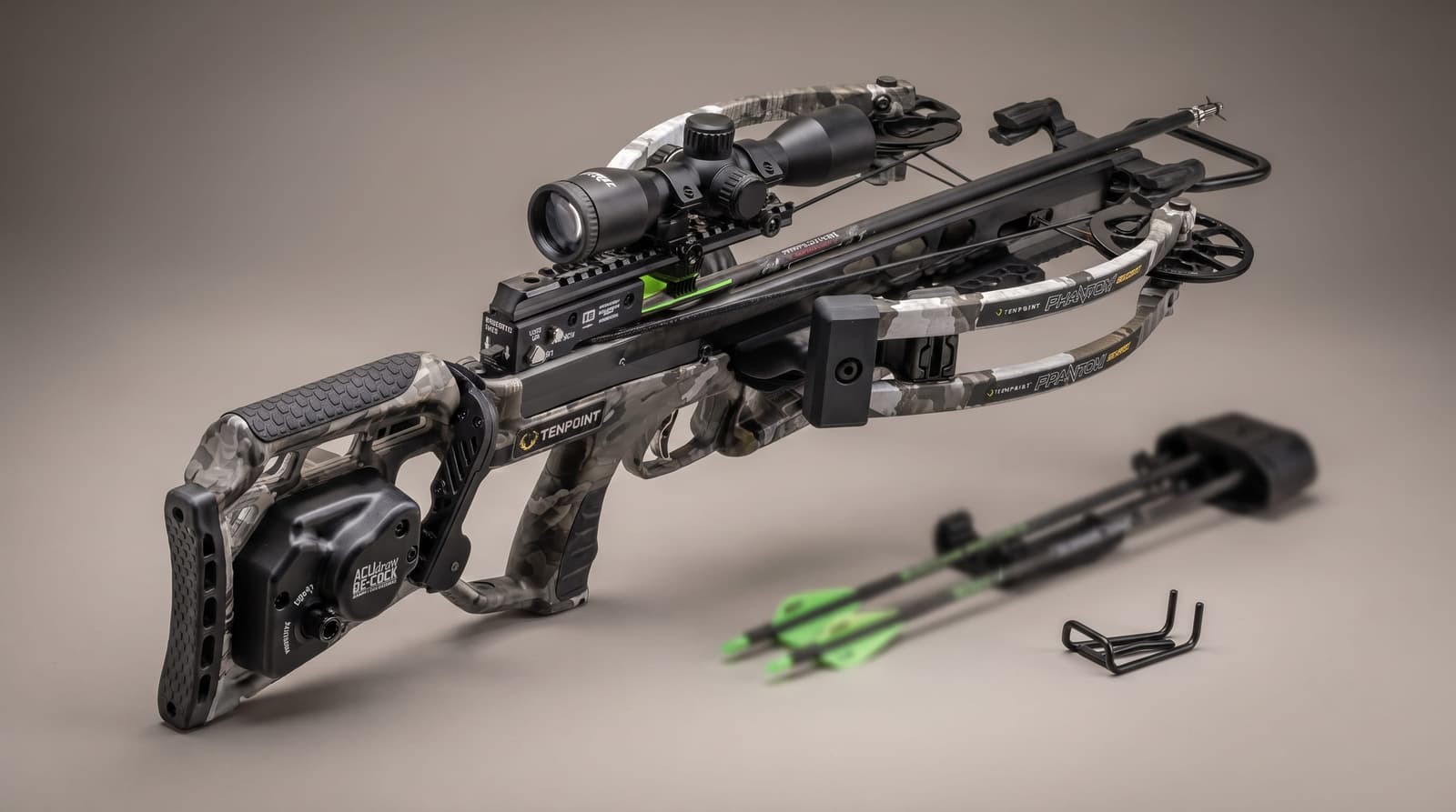 A compact reverse draw crossbow with a mounted lighted scope and an integrated cocking system along the barrel