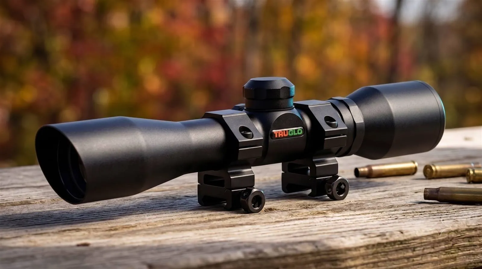 TruGlo 4x32 Compact crossbow scope with matte black housing and mounting rings photographed from the side
