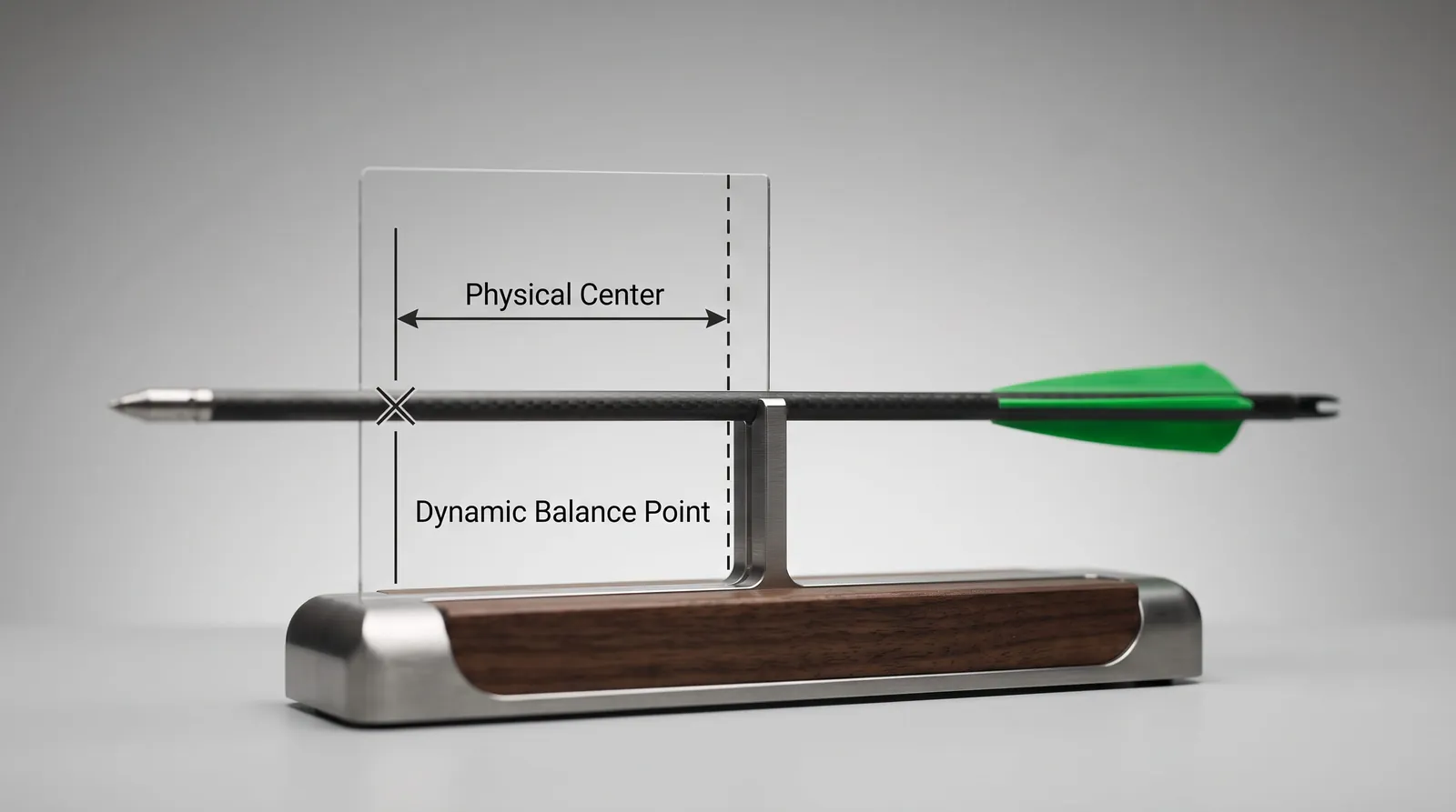 Carbon crossbow bolt balanced horizontally on a narrow support edge to find its balance point